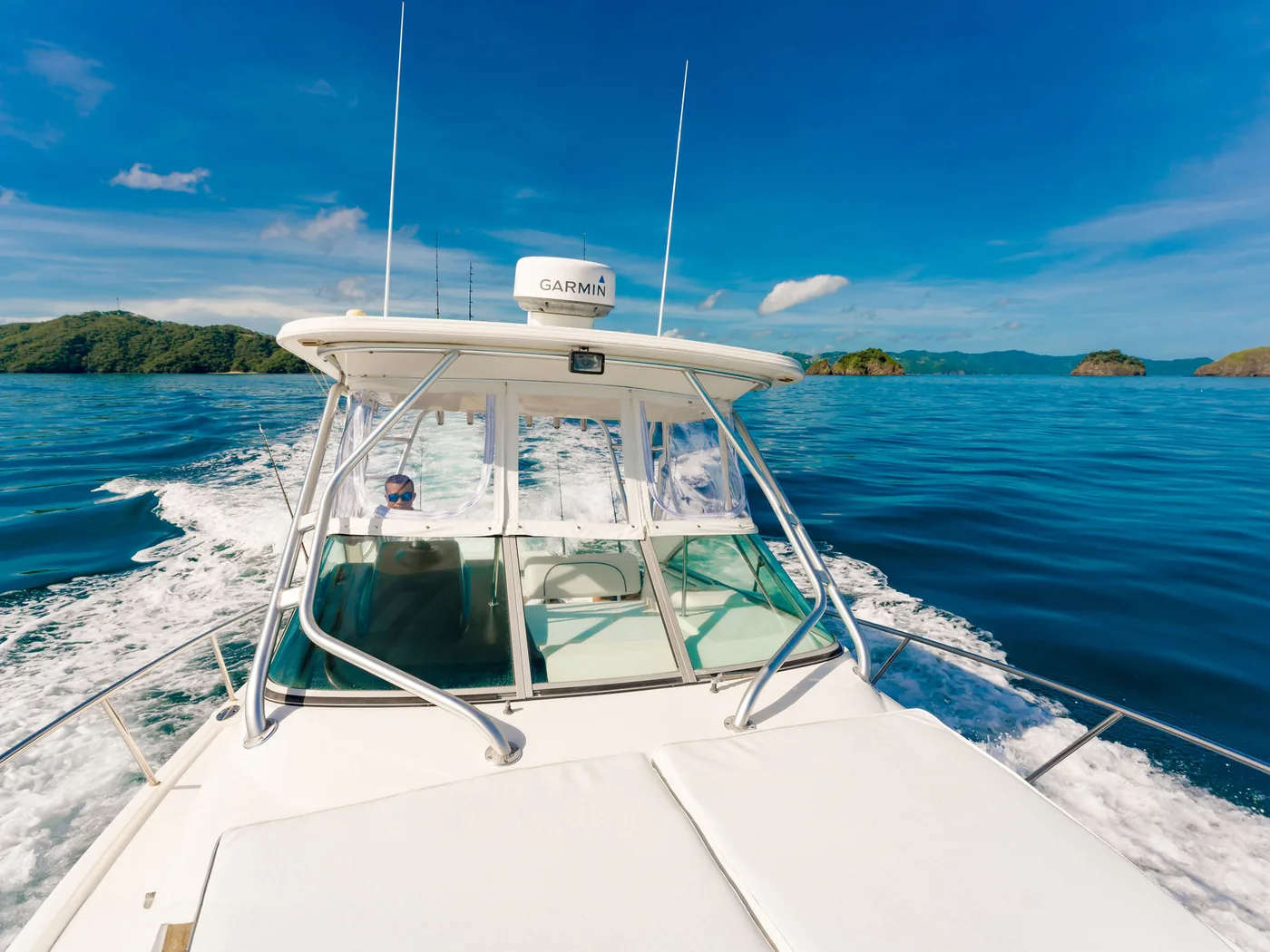 An Ocean Club center console anchored close to shore on an inshore charter, Guanacaste, Costa Rica