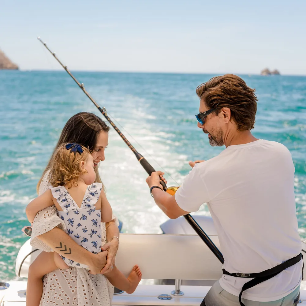 A father and child fishing together aboard an Ocean Club charter, Costa Rica
