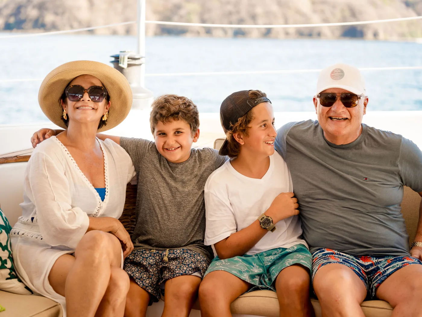 A group of guests together on the shaded deck of an Ocean Club catamaran, Costa Rica